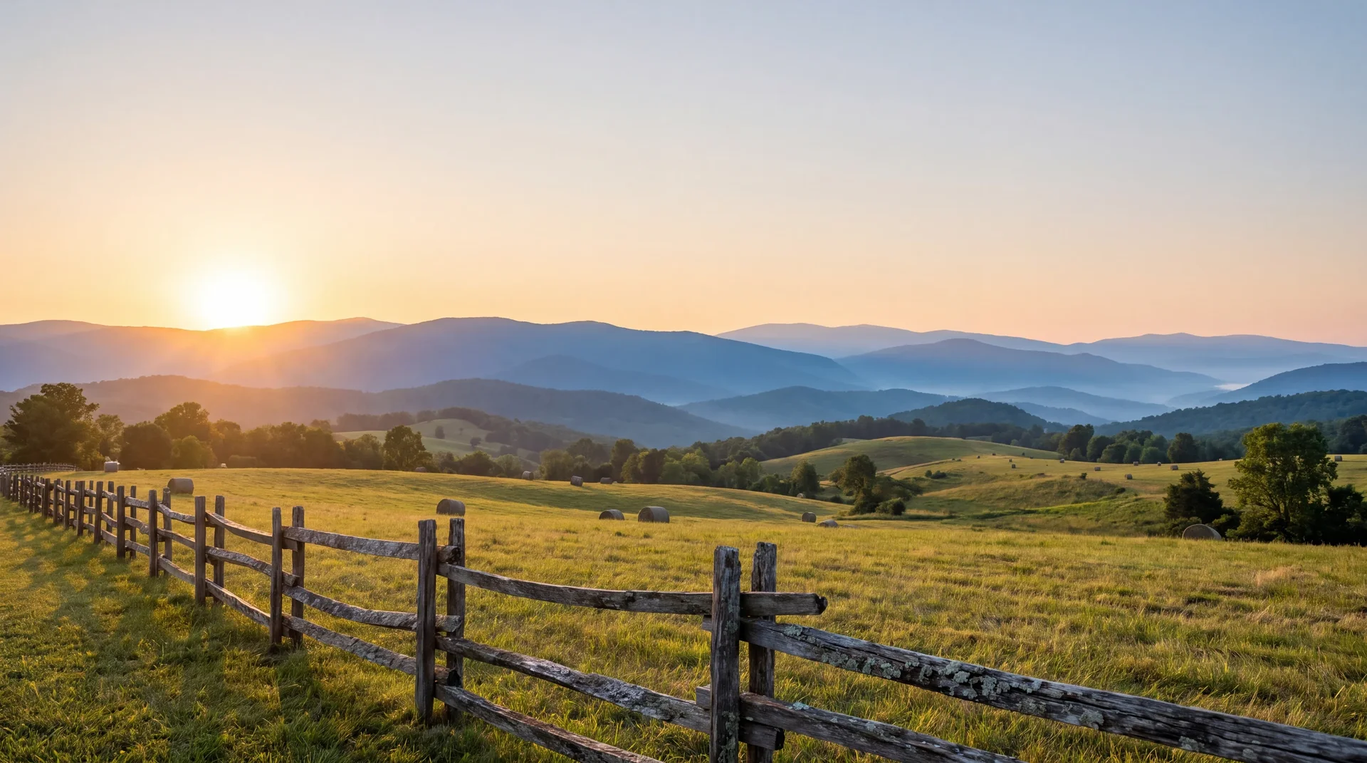 Illustration of mountains over a fenced pasture at sunrise
